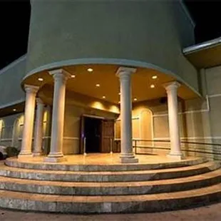 the entrance to a building at night