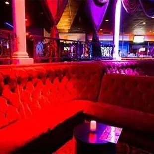 a red couch in a bar
