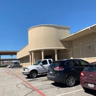 two cars parked in front of a building