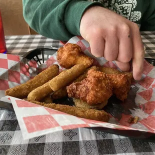 The Beehive appetizer tray - fried pickle spears, green tomatoes, spicy chicken wings and mozzarella sticks.