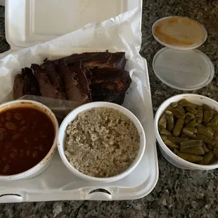 BBQ 2 Go! 2 Meat Plate with sliced beef, baby back ribs, cowboy beans, smoked rice and an extra side of green beans