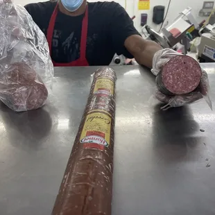 Here he is showing me the different types of summer sausage they have, they offer more but I was in a trance n didn&apos;t snap better photos.