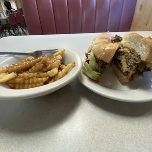 Double cheese burger and fries with gravy on top