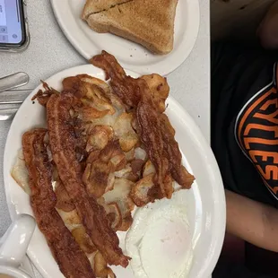 Bacon, eggs, American fries and toast