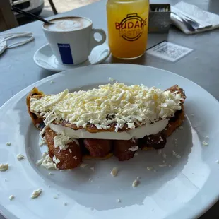 a plate of food and a cup of coffee