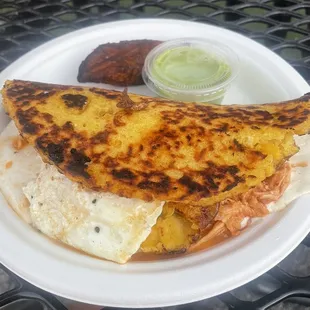 Cachapa with chicken, plantains, and fried egg