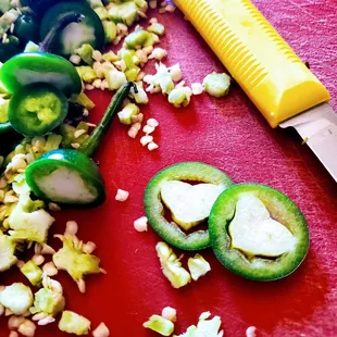 chopped jalapenos and a knife