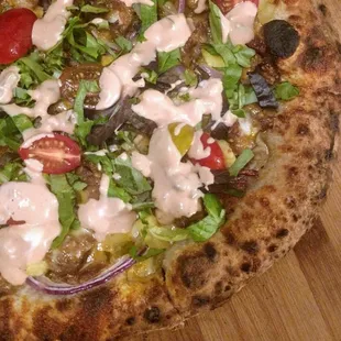 a pizza on a cutting board