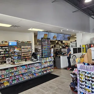 Behind the counter here.