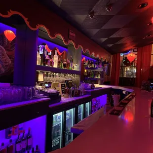 a bar with purple lighting