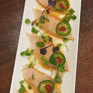 Yellowtail Jalapeno Carpaccio Yellowtail, jalapeno, sriracha, garlic ponzu