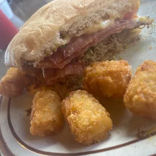 a sandwich and tater tots