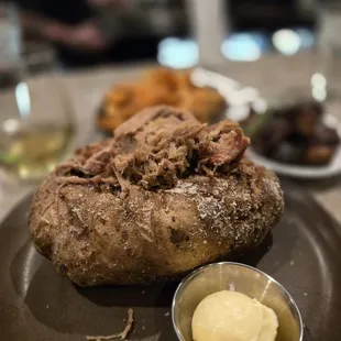 Yummy baked potato with pork.