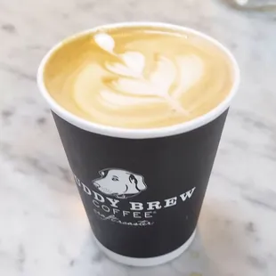 a cup of coffee with a spoon in it