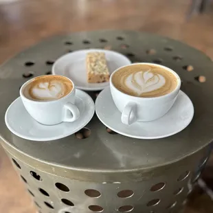 two cups of coffee on a table