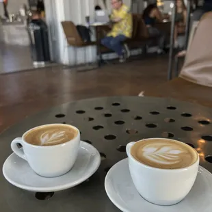 two cups of coffee on a table