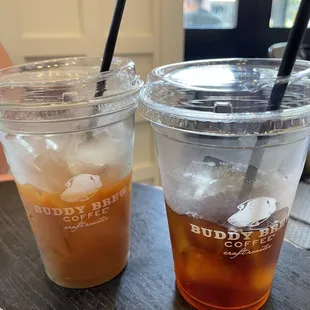 Iced americano with a splash of almond milk on the left, cold brew on the right.