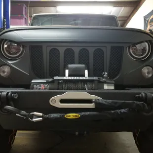 new bumper,grill,head lights and winch.