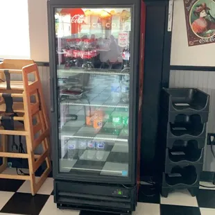 a refrigerator with a toy car on top