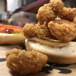 Spicy fried shrimp on a toasted sesame seed bun. Try mayo, mustard, onions, pickle, lettuce &amp; tomato.