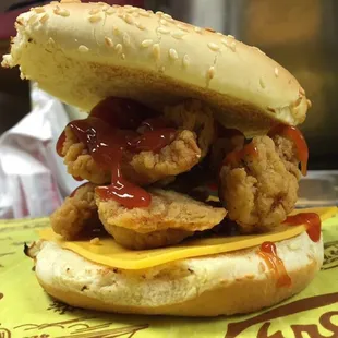 Fried oysters on a toasted bun with American cheese &amp; ketchup only.