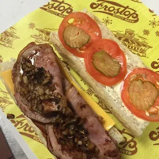 8 inch grilled ham po-boy with American cheese, grilled onions, light mayo, light pickle, tomato.