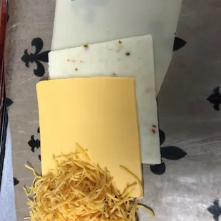 We have 4 cheeses to pick from; Shredded cheddar, American, Swiss &amp; pepper jack. Cheese is an extra charge.