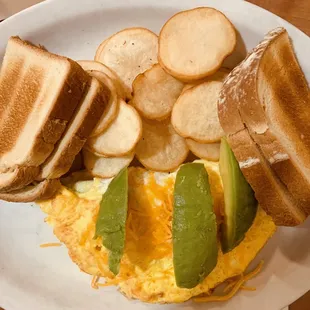 Spinach and cheese omelette with potatoes and sourdough toast