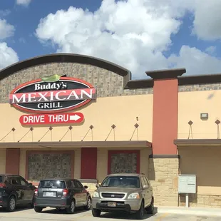 cars parked in front of the restaurant