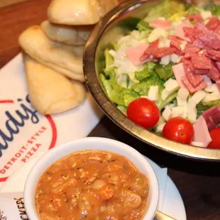 a bowl of soup and a bowl of salad