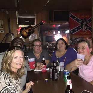 a group of people sitting at a table