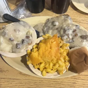 Country fried steak, mashed potatoes, and mac and cheese