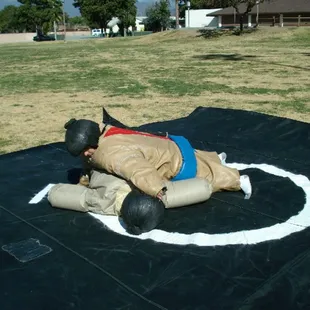 Sumo Suits and Wrestling Mat