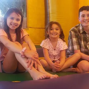 Four happy kids in their jumper