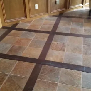 Grid pattern with wood and tile inlay.  Gorgeous floor!!
