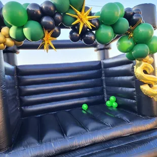 Black bounce house with garland