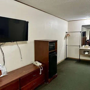 Nice view of dresser, tv, microwave/refrigerator, common sink