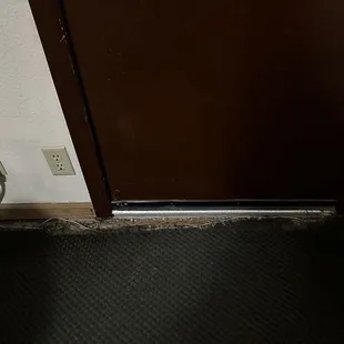 Carpet missing near door/wall