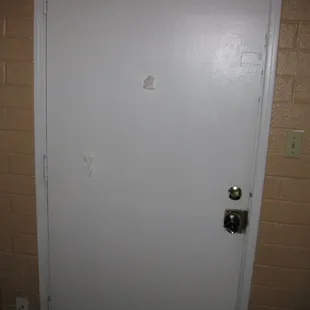 Check out the kleenex plugging the holes on the inside of motel room door.