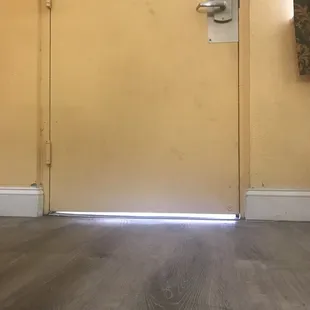 Wide crack under door to outside.