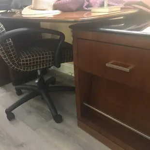 My side table is used to hold up a broken desk missing one leg.