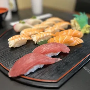 Tuna, salmon, and ebi on the platter- fresh and delicious