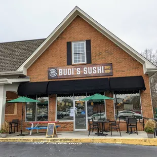 Outside. Storefront and patio seating. Located in Dunwoody Plaza across from Dunwoody Village.