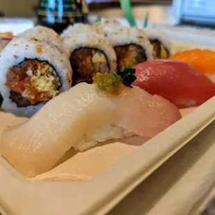 Lunch combo special. $10.75. Three kinds of nigiri or sashimi, roll, and veggie spring roll.