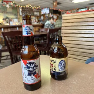 two beer bottles on a table