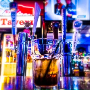 a drink in a glass on a bar