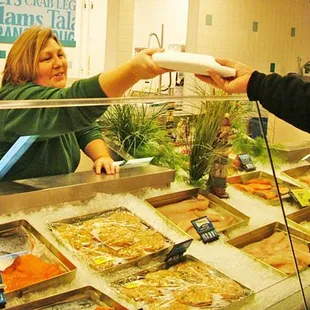 a woman serving a customer