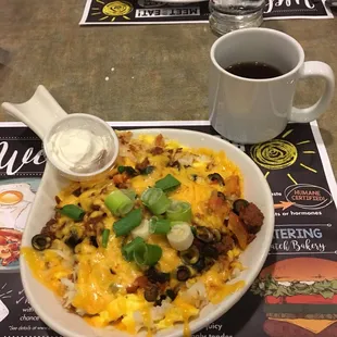 a plate of food and a cup of coffee