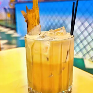 a drink with ice and a straw
