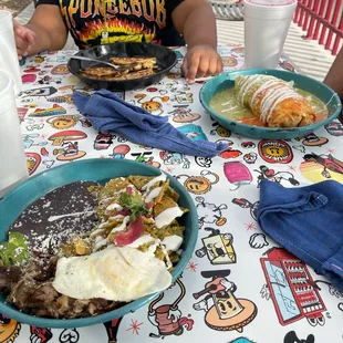 Verde chilaquiles, carnitas. Super burro. Chicken tacos didn't come with beans